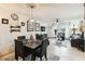 Dining area with a table set for four, adjacent to living room at 6630 Spring Flower Dr # 14, New Port Richey, FL 34653