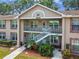 Charming two-story condo with stairs to the second floor, freshly landscaped and well maintained at 6630 Spring Flower Dr # 14, New Port Richey, FL 34653