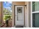 Charming front door with decorative wreath and sidelight window at 6630 Spring Flower Dr # 14, New Port Richey, FL 34653