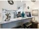 Bright kitchen with a pass-through bar area boasts stainless steel appliances, white cabinets, and ample counter space at 6630 Spring Flower Dr # 14, New Port Richey, FL 34653