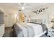 Comfortable bedroom offers a ceiling fan, closet, and tv at 6630 Spring Flower Dr # 14, New Port Richey, FL 34653