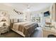Cozy main bedroom features a ceiling fan, tv, and large windows at 6630 Spring Flower Dr # 14, New Port Richey, FL 34653