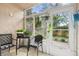 Relaxing screened porch features tiled flooring and views of the yard and garden at 6630 Spring Flower Dr # 14, New Port Richey, FL 34653