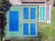 Aerial view of community tennis courts, and shuffleboard courts at 6630 Spring Flower Dr # 14, New Port Richey, FL 34653