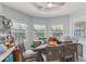 Cozy dining room featuring a view of the outside pool at 6645 Freeport Dr, Spring Hill, FL 34608