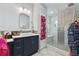 Modern main bathroom featuring a sleek vanity and a glass-enclosed shower at 6645 Freeport Dr, Spring Hill, FL 34608
