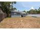 Spacious backyard with picnic table, barbecue, and partially fenced in at 6817 S Gabrielle St, Tampa, FL 33611