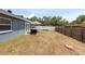 Large backyard offers a picnic table with umbrella and outdoor kitchen area at 6817 S Gabrielle St, Tampa, FL 33611