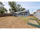 This house features a large backyard with a barbecue and garden box at 6817 S Gabrielle St, Tampa, FL 33611