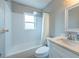 This bathroom showcases a shower-tub combination and modern fixtures at 6817 S Gabrielle St, Tampa, FL 33611