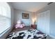 Cozy bedroom features a full-sized bed, closet, and a plush unicorn at 6817 S Gabrielle St, Tampa, FL 33611