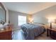 Comfortable bedroom with hardwood floors, dresser, and natural light at 6817 S Gabrielle St, Tampa, FL 33611