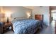 Bedroom featuring wood floors, dresser, and side tables at 6817 S Gabrielle St, Tampa, FL 33611