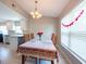 Inviting dining area featuring a table set for six and an elegant chandelier at 6817 S Gabrielle St, Tampa, FL 33611