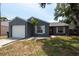 Charming single-story home featuring a well-maintained lawn and attached one car garage at 6817 S Gabrielle St, Tampa, FL 33611