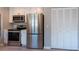Kitchen features stainless steel appliances and white cabinetry for a modern look at 6817 S Gabrielle St, Tampa, FL 33611