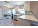 Bright kitchen featuring modern appliances, quartz countertops, and stylish cabinets at 6817 S Gabrielle St, Tampa, FL 33611