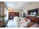Comfortable living room featuring hardwood floors and a large window that lets in plenty of natural light at 6817 S Gabrielle St, Tampa, FL 33611