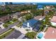 Beautiful neighborhood aerial view showcasing tropical landscaping and close proximity to the water at 7114 Pelican Island Dr, Tampa, FL 33634