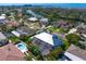 Beautiful aerial view of neighborhood showcasing mature landscaping and waterway access at 7114 Pelican Island Dr, Tampa, FL 33634