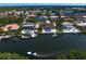 Waterfront property with a private dock, boats, and a sparkling pool, perfect for outdoor living at 7114 Pelican Island Dr, Tampa, FL 33634