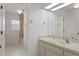 Bathroom featuring a large mirror over the vanity, and access to the shower and toilet at 7114 Pelican Island Dr, Tampa, FL 33634