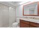 Bathroom featuring a glass shower and modern vanity at 7114 Pelican Island Dr, Tampa, FL 33634