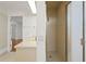 Bathroom featuring tiled shower, neutral countertops, and ample lighting at 7114 Pelican Island Dr, Tampa, FL 33634