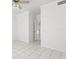 Bright bedroom featuring tile floors and a ceiling fan at 7114 Pelican Island Dr, Tampa, FL 33634