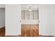 Bedroom with hardwood floors and a built-in closet at 7114 Pelican Island Dr, Tampa, FL 33634