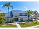 Inviting home showcasing manicured landscaping, a covered entryway, and a durable metal roof at 7114 Pelican Island Dr, Tampa, FL 33634