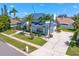 Gorgeous property with a metal roof, complemented by vibrant landscaping and a well-maintained lawn at 7114 Pelican Island Dr, Tampa, FL 33634