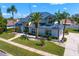 Beautiful home with a metal roof, manicured landscaping, and a welcoming entrance at 7114 Pelican Island Dr, Tampa, FL 33634