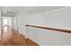 Open hallway area features hardwood floors and white walls at 7114 Pelican Island Dr, Tampa, FL 33634