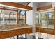 Bright kitchen features lots of natural light, wooden cabinets, granite countertops, and stainless steel appliances at 7114 Pelican Island Dr, Tampa, FL 33634
