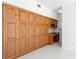 Home office featuring a built-in desk and cabinets at 7114 Pelican Island Dr, Tampa, FL 33634
