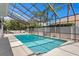 Inviting screened pool with a spacious deck area, perfect for outdoor entertaining and relaxation at 7114 Pelican Island Dr, Tampa, FL 33634