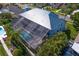 A large screened-in pool enclosure offers a relaxing outdoor living space at 7114 Pelican Island Dr, Tampa, FL 33634