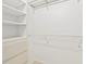 Organized walk-in closet with shelves and drawers, perfect for wardrobe storage at 7114 Pelican Island Dr, Tampa, FL 33634