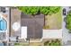 This is an aerial view of the home, showing the roof, driveway, and pool at 7276 21St Street N, St Petersburg, FL 33702