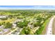An aerial view of a residential neighborhood adjacent to the highway and a nearby lake at 7276 21St Street N, St Petersburg, FL 33702