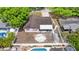 Aerial view of home with fenced yard, pool, and convenient storage shed at 7276 21St Street N, St Petersburg, FL 33702