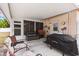 Covered back patio with a grill and furnishings at 7276 21St Street N, St Petersburg, FL 33702