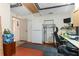 The basement area includes workspace, storage, and a refrigerator at 7276 21St Street N, St Petersburg, FL 33702