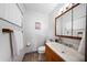 Clean bathroom featuring a wood vanity, mirror and towel rack at 7276 21St Street N, St Petersburg, FL 33702