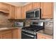 Close-up of the kitchen with stainless steel appliances and plenty of cabinets at 7276 21St Street N, St Petersburg, FL 33702