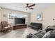 Inviting living room featuring tile floors, a ceiling fan, and comfortable seating area at 7276 21St Street N, St Petersburg, FL 33702