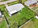 Aerial view of fenced backyard with screened patio, showcasing the home's layout and outdoor space at 7930 Jeffery Ave, North Port, FL 34287