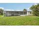 Generous backyard with a spacious screen-enclosed patio, providing a seamless transition between indoor and outdoor living at 7930 Jeffery Ave, North Port, FL 34287