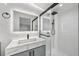 Modern bathroom features stylish marble-look vanity and glass-enclosed shower at 7930 Jeffery Ave, North Port, FL 34287